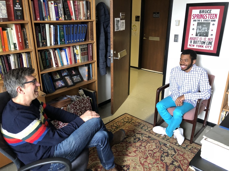 A professor and student chat during office hours