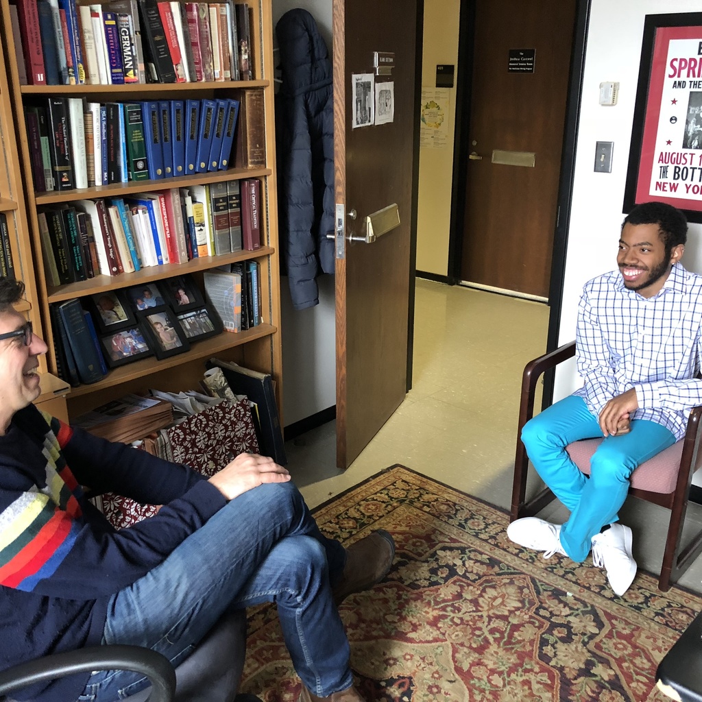 A professor and student chat during office hours